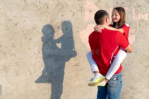 happy-dad-holding-daughter-shadow-wall-inscription-i-love-you-shape-red-heart-concept-family-understanding-172242430.jpg